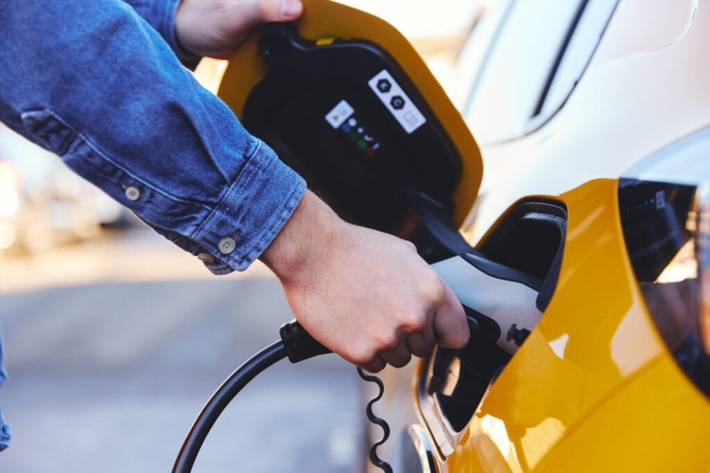 Electric car plugged in outside house