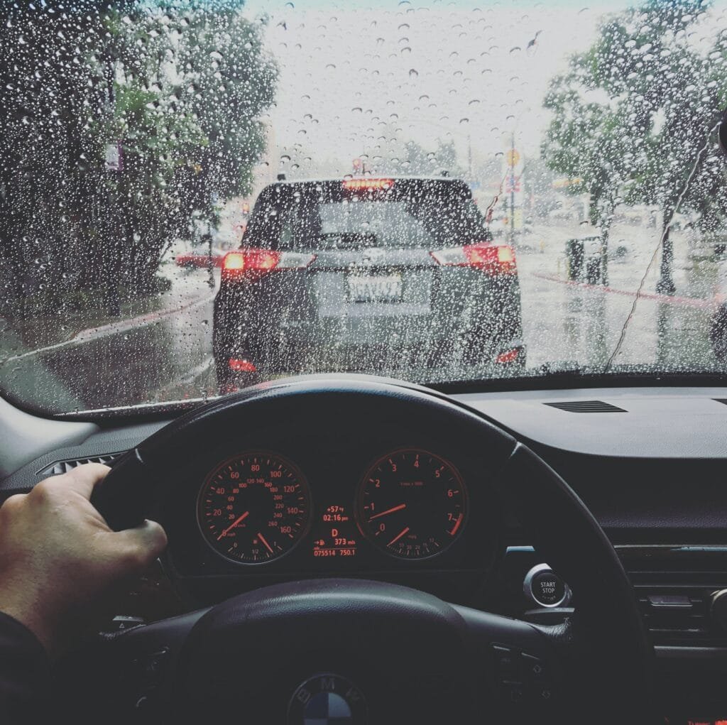 Driving a car in the rain on a rainy day